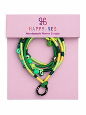 Amalfi phone strap in its open gift box with phone case and phone patch in pink, black and purple