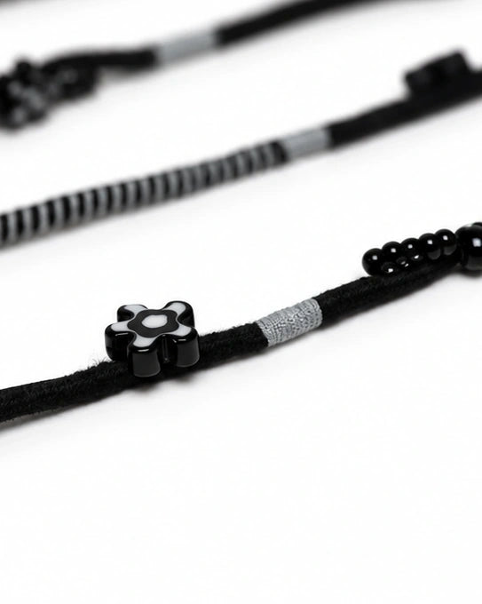 Domino Beaded Lightning EarPods — handmade Apple Lightning earphones in black and grey with flower and seed beads – photo 4
