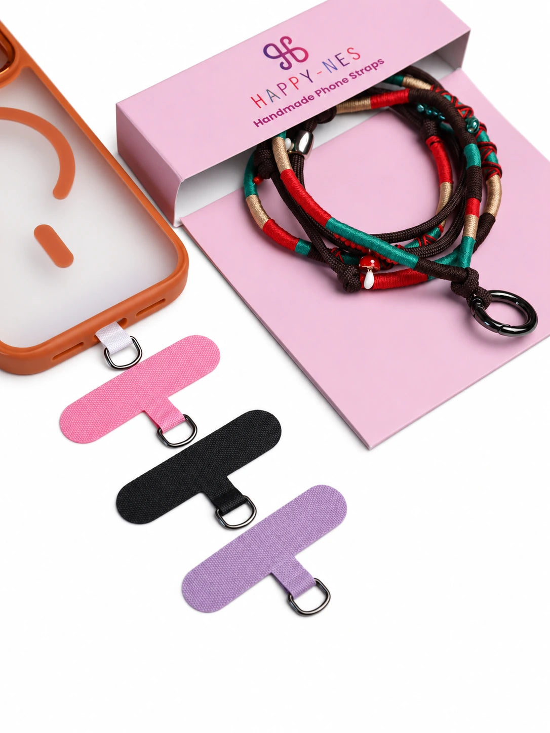 Marrakech phone strap in its open gift box with phone case and phone patch in pink, black and purple