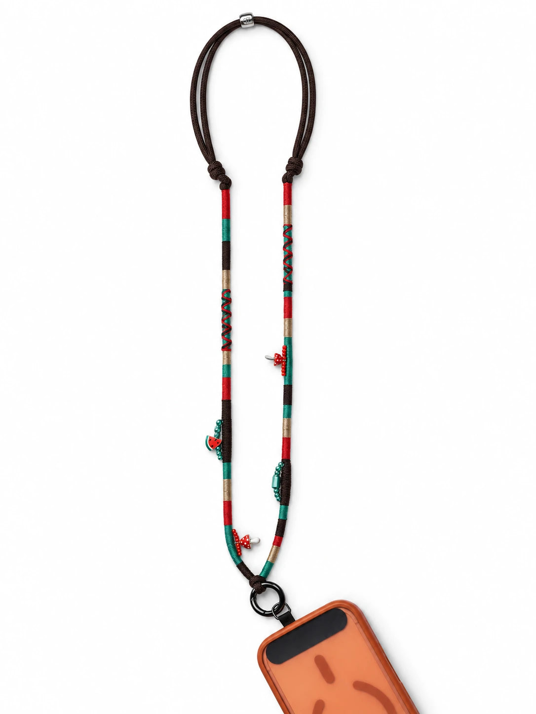 Marrakech handmade phone strap worn crossbody in brown, red, emerald and gold with mushroom beads